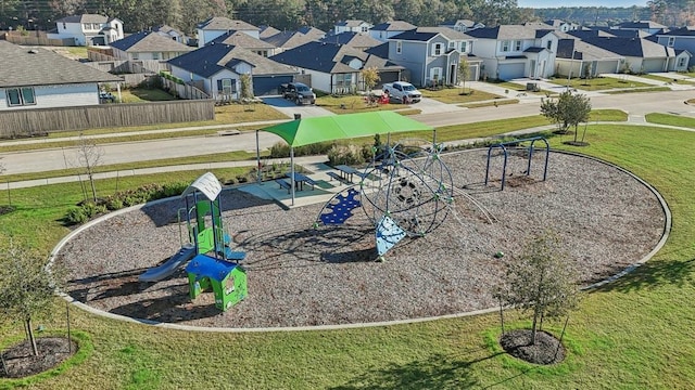 view of property's community with a residential view, playground community, and a yard