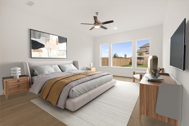 bedroom featuring recessed lighting, visible vents, ceiling fan, and wood finished floors