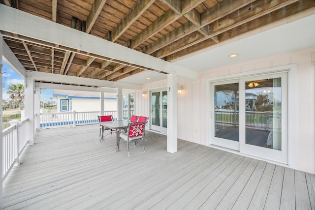 wooden terrace with outdoor dining space