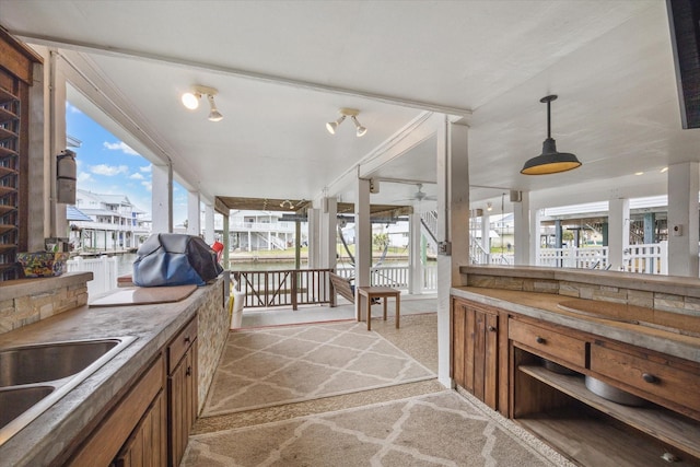 interior space with covered porch and a sink