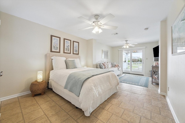 bedroom with access to outside, visible vents, stone tile floors, and baseboards