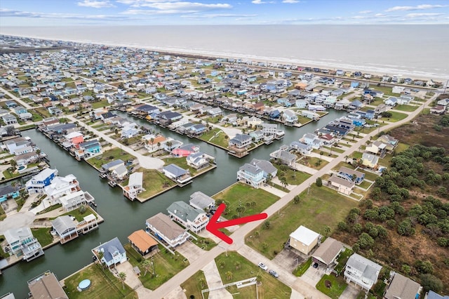 birds eye view of property featuring a residential view and a water view