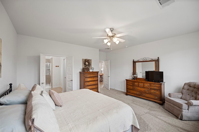 bedroom featuring light carpet, ceiling fan, and visible vents