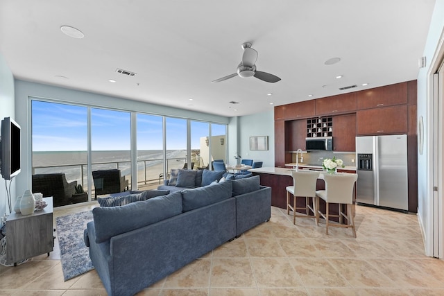 living room featuring recessed lighting, visible vents, ceiling fan, and light tile patterned floors