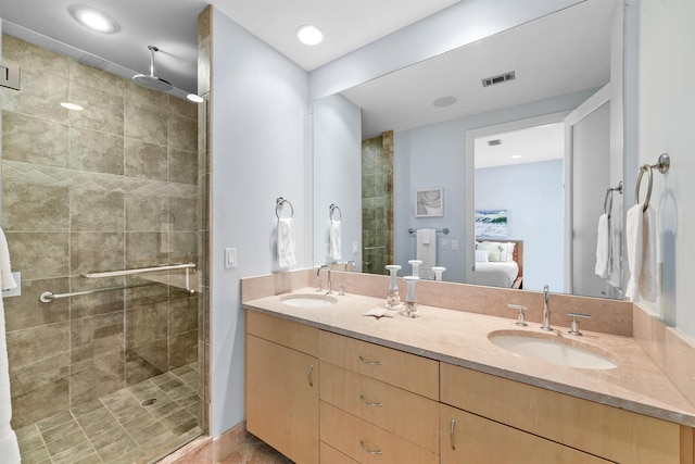 ensuite bathroom featuring ensuite bath, a sink, visible vents, and a shower stall