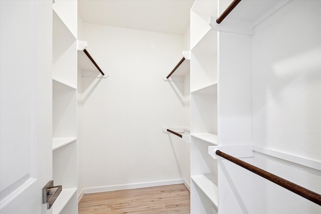 spacious closet with wood finished floors