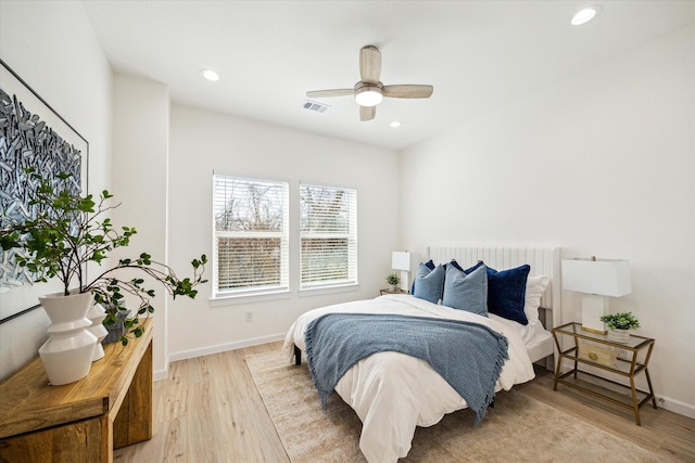 bedroom featuring recessed lighting, visible vents, baseboards, and wood finished floors