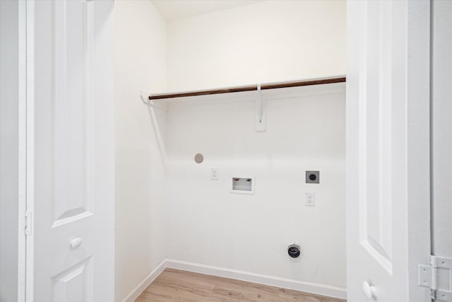 washroom with hookup for a washing machine, light wood-style flooring, hookup for a gas dryer, laundry area, and electric dryer hookup