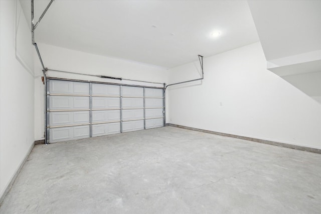 garage featuring baseboards