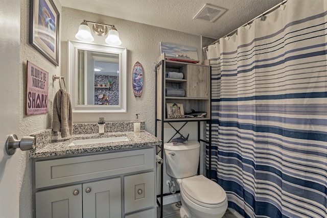 full bath featuring visible vents, a textured wall, and a textured ceiling