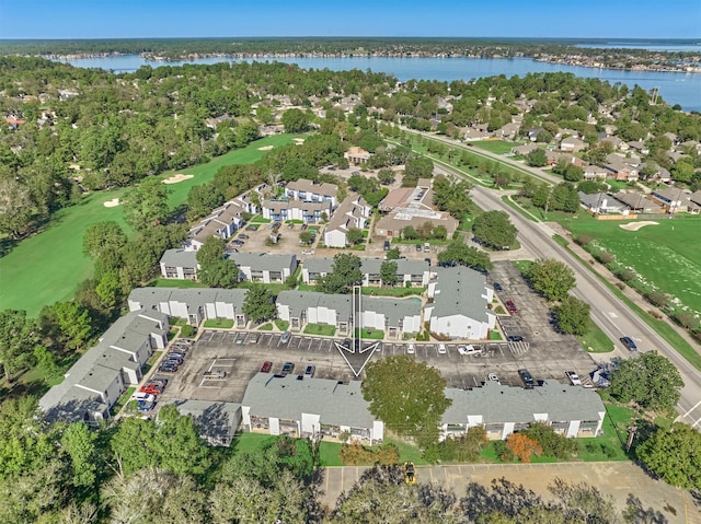 bird's eye view featuring view of golf course, a water view, and a residential view