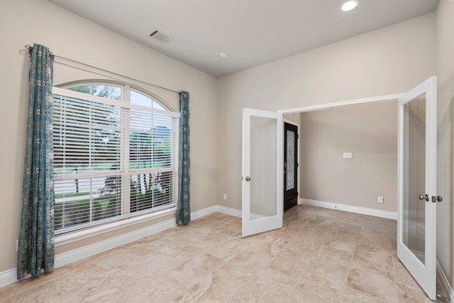 unfurnished room with french doors, recessed lighting, visible vents, and baseboards