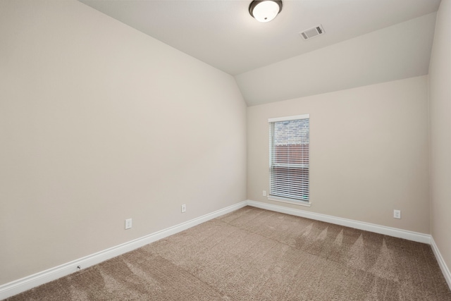 5615 Alexan Crest Dr, Fulshear, TX 77441 - spare room with baseboards, carpet flooring, and lofted ceiling