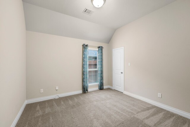 5615 Alexan Crest Dr, Fulshear, TX 77441 - carpeted empty room featuring lofted ceiling and baseboards