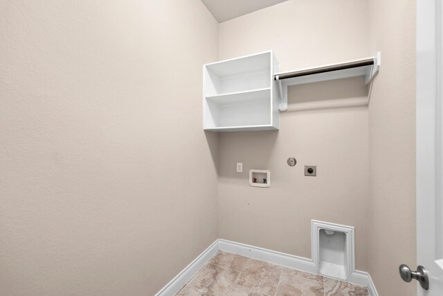 5615 Alexan Crest Dr, Fulshear, TX 77441 - laundry room with hookup for an electric dryer, hookup for a gas dryer, washer hookup, and baseboards