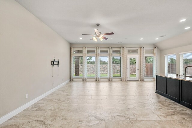 5615 Alexan Crest Dr, Fulshear, TX 77441 - unfurnished living room with ceiling fan, baseboards, recessed lighting, and a sink