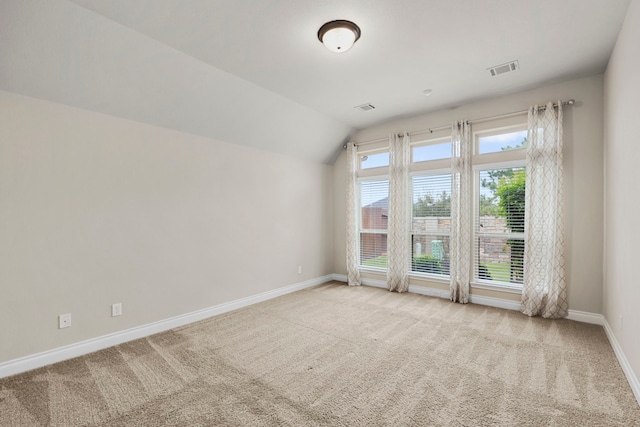 5615 Alexan Crest Dr, Fulshear, TX 77441 - empty room with baseboards, carpet floors, and vaulted ceiling