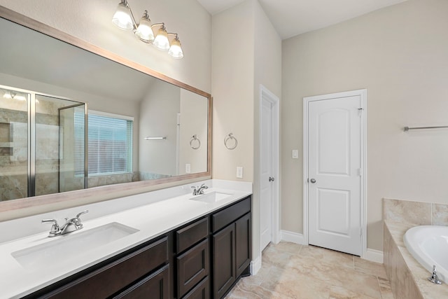 full bathroom featuring double vanity, a garden tub, a sink, and a stall shower