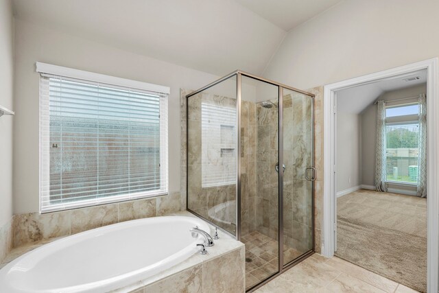 5615 Alexan Crest Dr, Fulshear, TX 77441 - full bathroom with a garden tub, a stall shower, vaulted ceiling, baseboards, and tile patterned flooring