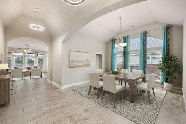 5615 Alexan Crest Dr, Fulshear, TX 77441 - dining room featuring vaulted ceiling, arched walkways, a chandelier, ceiling fan, and baseboards