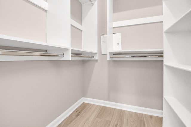 spacious closet with wood finished floors