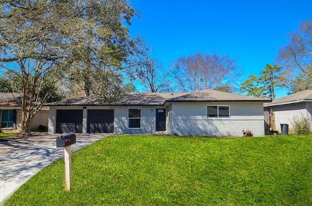 ranch-style home with a garage, a front yard, concrete driveway, and brick siding