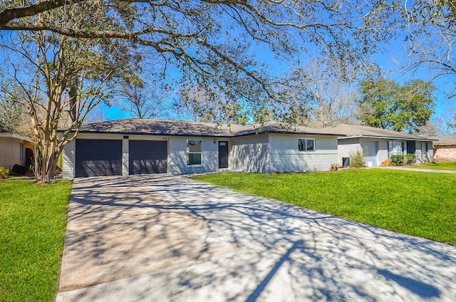 single story home with an attached garage, brick siding, concrete driveway, and a front yard