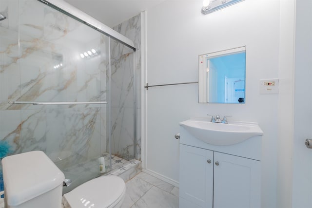 bathroom featuring marble finish floor, vanity, a marble finish shower, and toilet