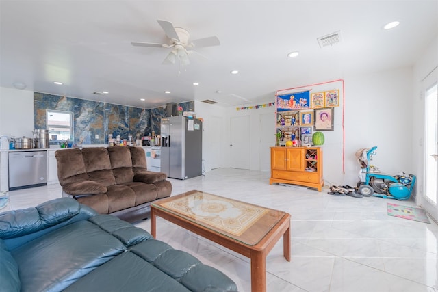 living room with recessed lighting, visible vents, and ceiling fan