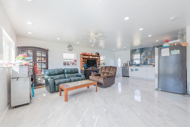 living area with marble finish floor, ceiling fan, and recessed lighting