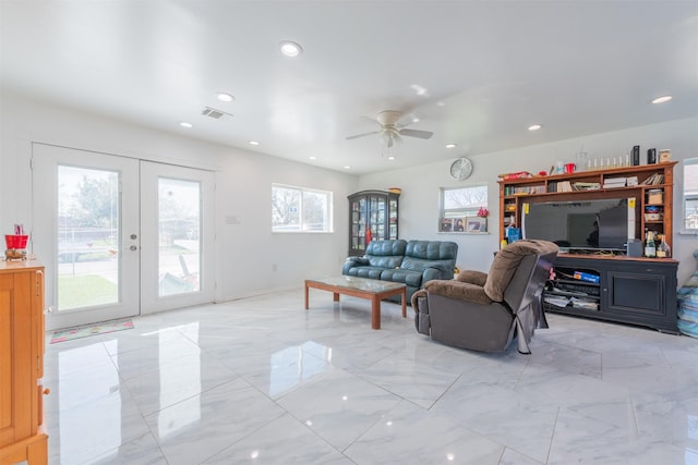 living room featuring recessed lighting, french doors, visible vents, and marble finish floor