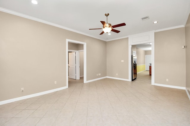 unfurnished room with ceiling fan, baseboards, and crown molding