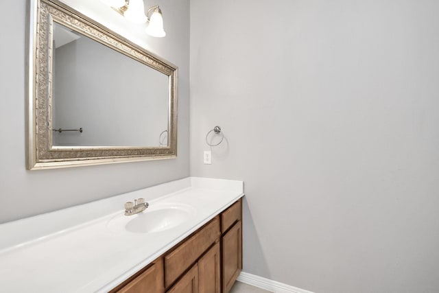 bathroom featuring vanity and baseboards