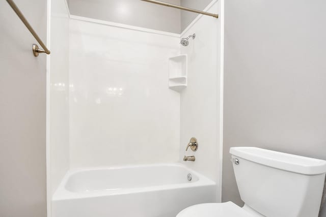 full bathroom featuring tub / shower combination and toilet