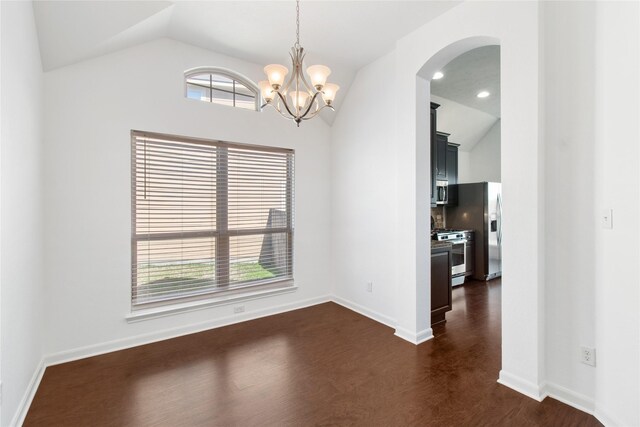 unfurnished dining area with baseboards, vaulted ceiling, and a wealth of natural light