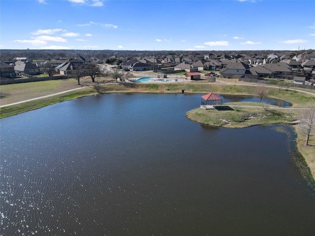 aerial view featuring a water view and a residential view