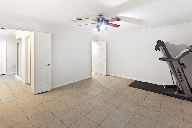 workout room featuring baseboards, visible vents, crown molding, and tile patterned floors