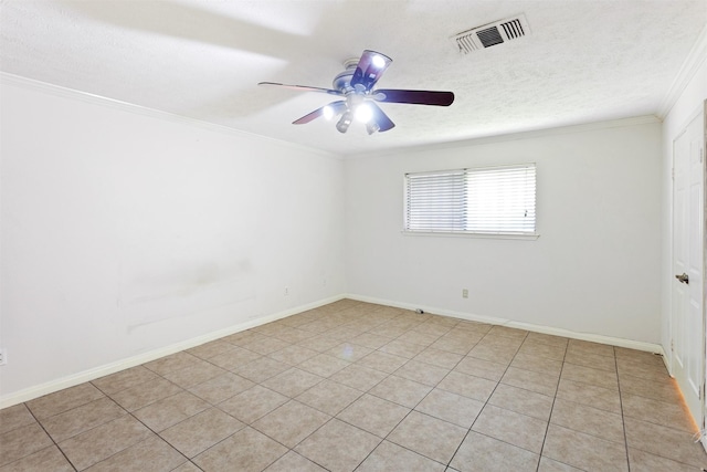 empty room featuring a textured ceiling, ceiling fan, visible vents, and crown molding