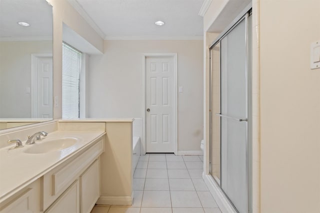 full bathroom with crown molding, a stall shower, vanity, baseboards, and tile patterned floors