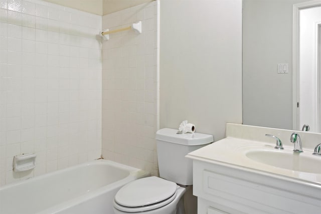 bathroom with toilet, shower / tub combination, and vanity