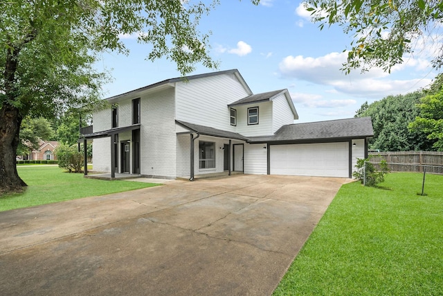 traditional home featuring a garage, brick siding, fence, concrete driveway, and a front yard