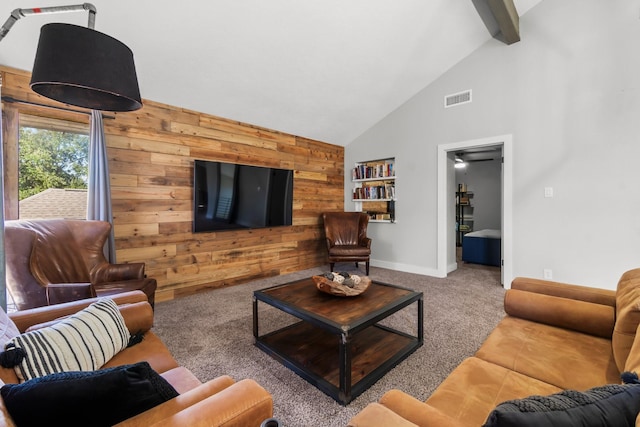 living room featuring wooden walls, visible vents, beamed ceiling, carpet flooring, and high vaulted ceiling