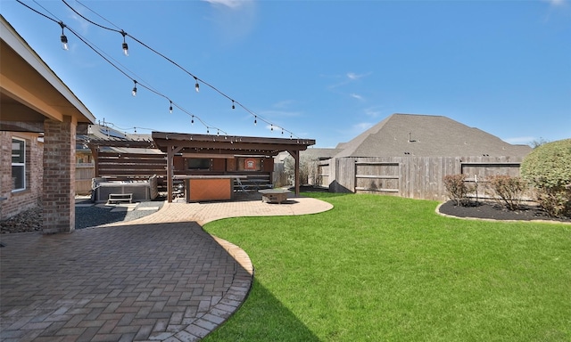 view of yard featuring a fire pit, a patio, a fenced backyard, and a hot tub