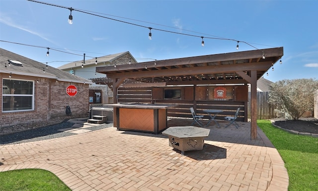 view of patio / terrace featuring fence