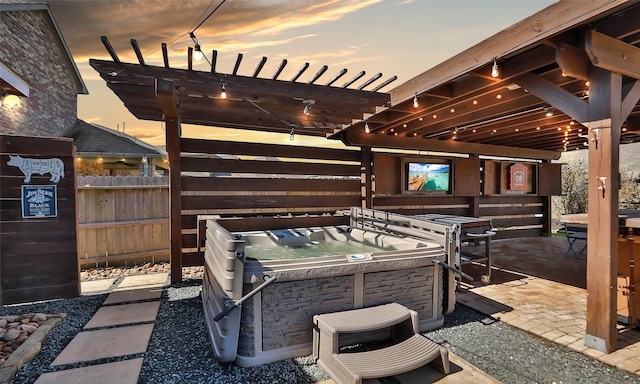 view of patio featuring fence, a hot tub, and a pergola