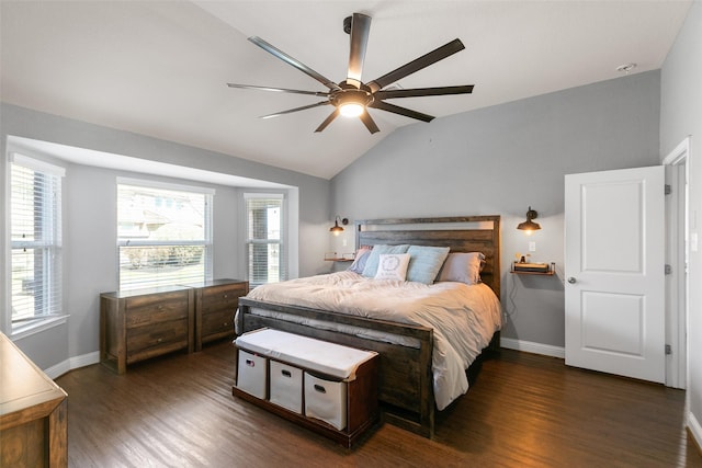 bedroom with a ceiling fan, baseboards, vaulted ceiling, and wood finished floors