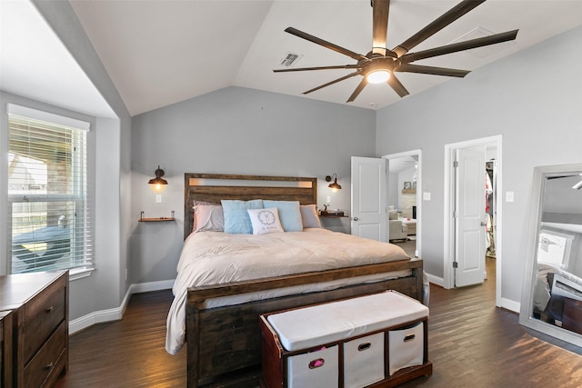 bedroom featuring lofted ceiling, baseboards, visible vents, and dark wood finished floors