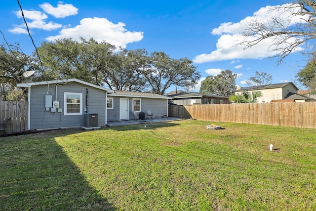 rear view of house with cooling unit and a patio