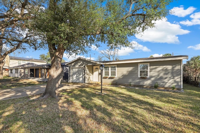 ranch-style home with a garage and a front yard