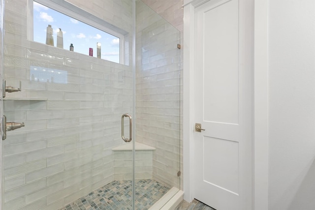 full bath with a shower stall